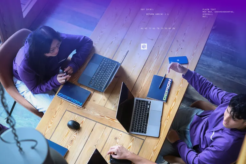 DEFION engineers collaborating over shared desks