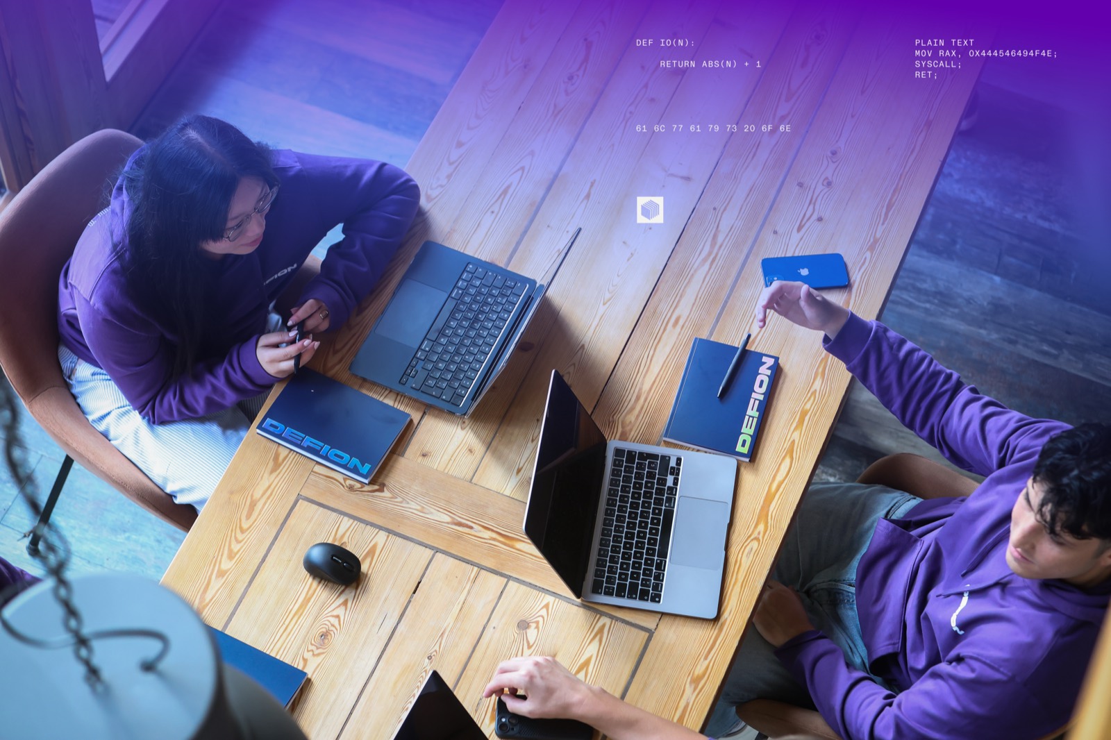 DEFION engineers collaborating over shared desks