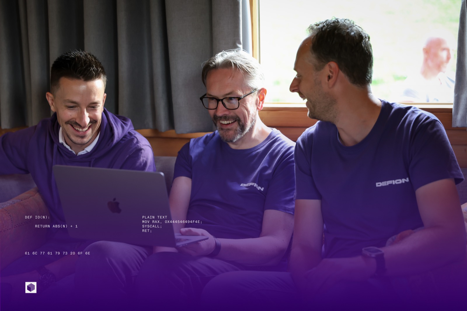 Three DEFION colleagues relaxing on a couch after hours